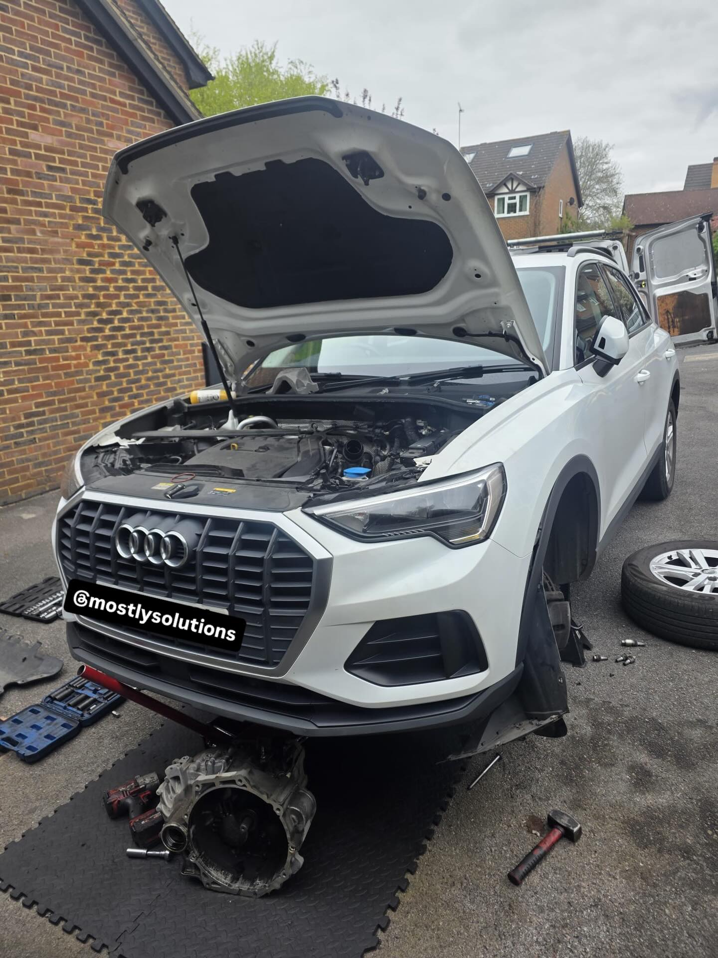 Full clutch replacement on the driveway — gearbox out, new kit in, smooth shifting restored.